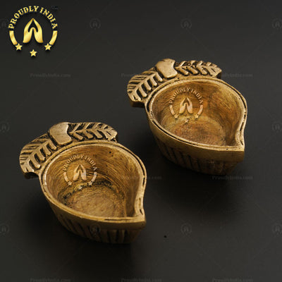 Set of 2 Brass Mango Shape Diya in Antique Finish.